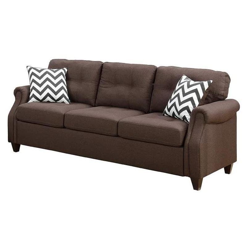 Brown fabric sofa with tufted cushions and chevron accent pillows