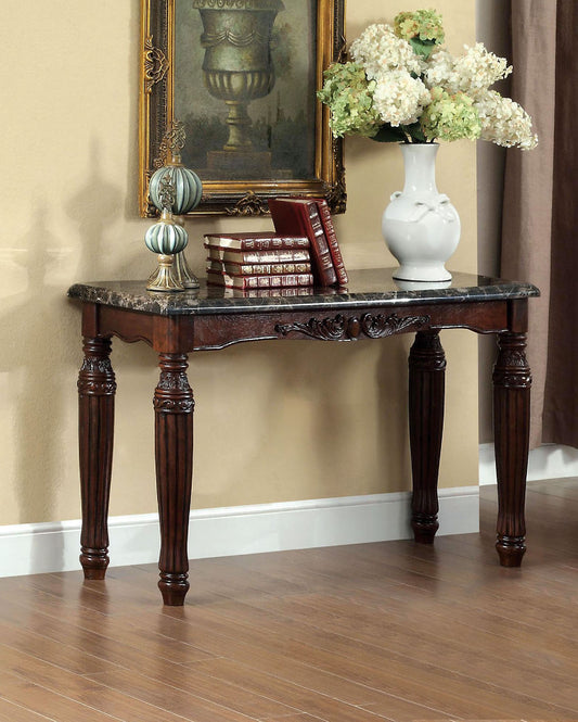 Ornate dark wood console table with marble top and carved legs