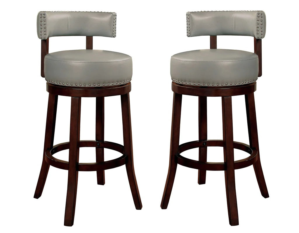 Two light grey leatherette bar stools with dark wood base and brass studs