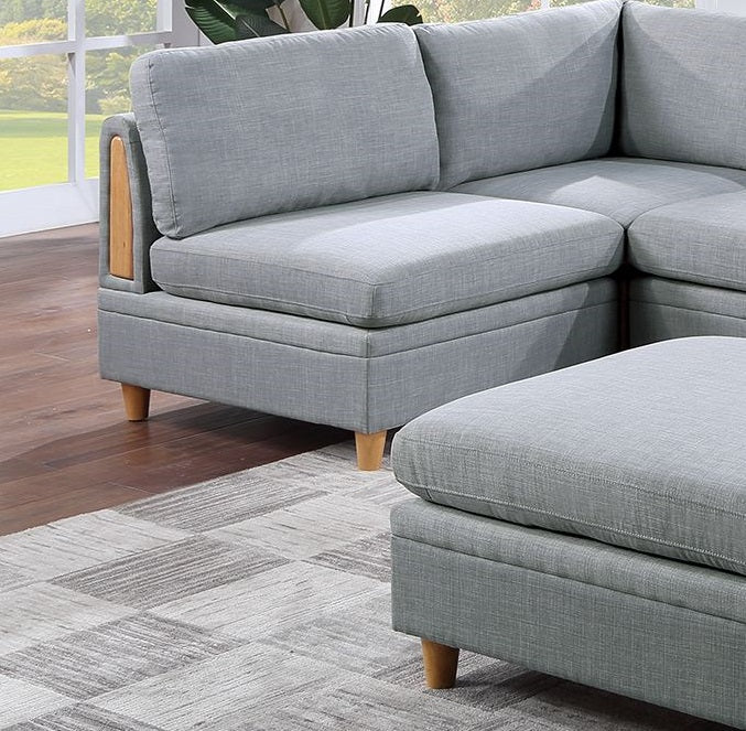 Grey fabric sectional sofa with wooden armrest detail and natural wood legs