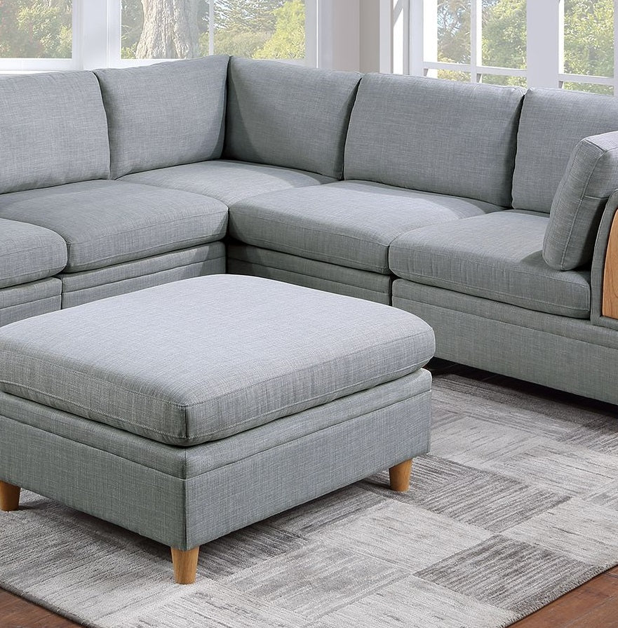Light grey fabric sectional sofa with matching storage ottoman perfect for living rooms