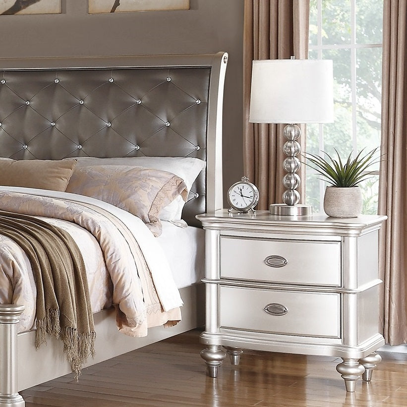 Glamorous silver tufted headboard with crystal accents for a luxurious bedroom