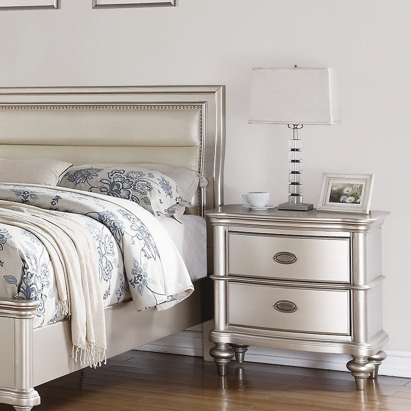 Silver twodrawer nightstand with decorative hardware and ornate legs