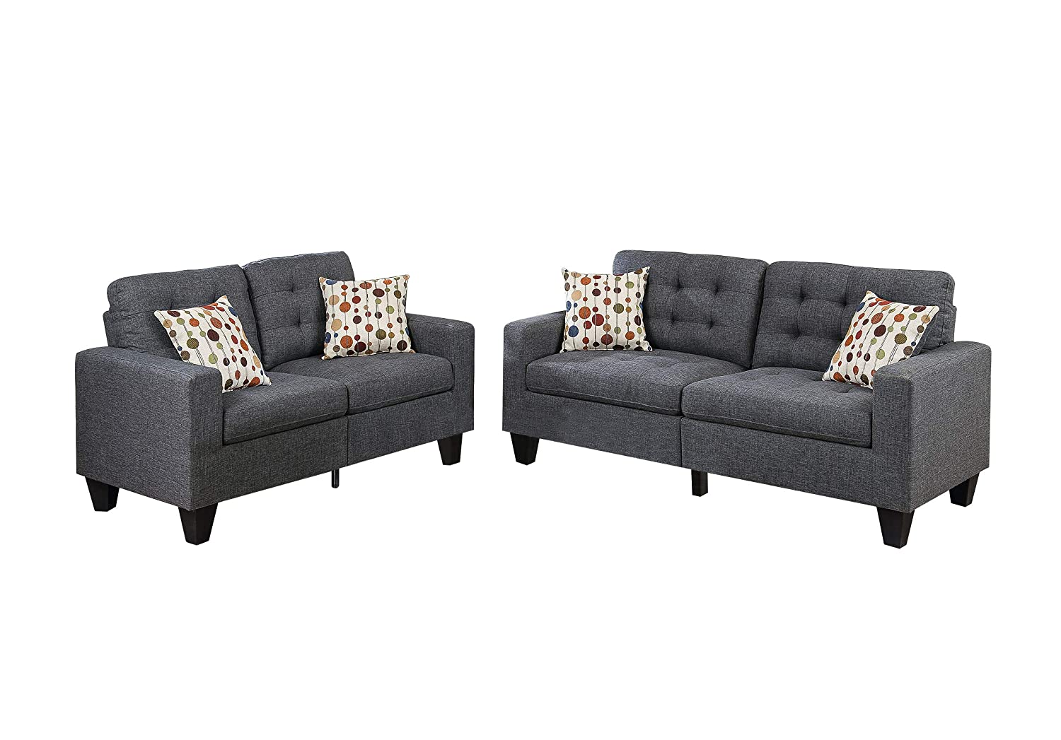 Dark gray upholstered seater sofa with tufted back and decorative pillows