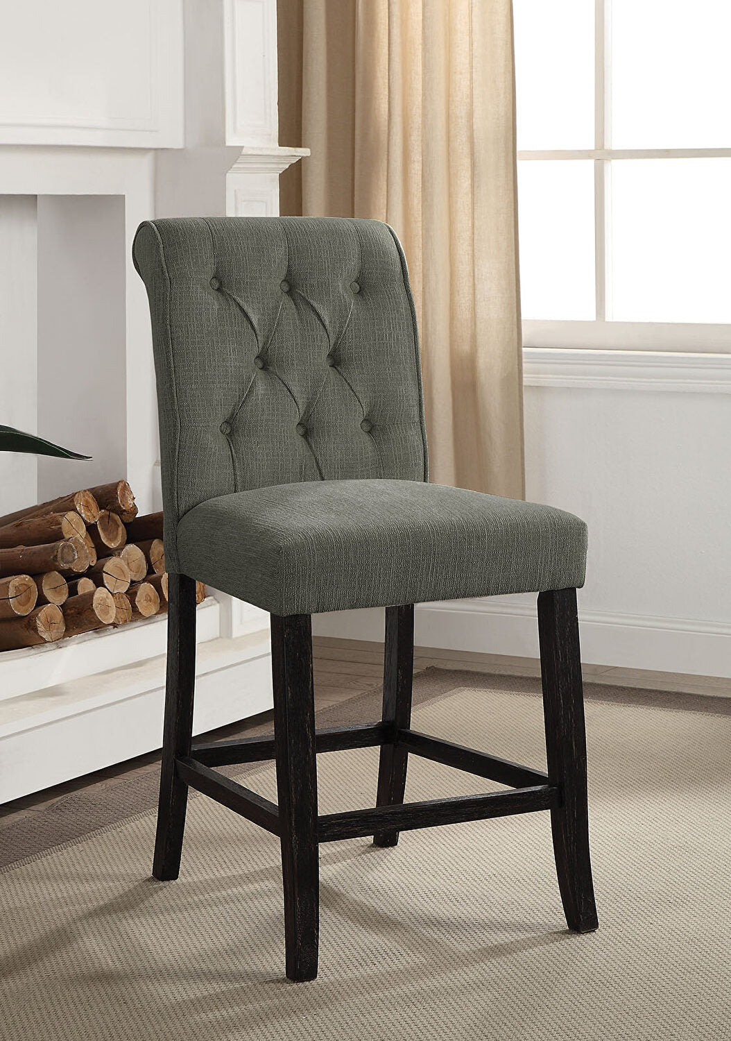 Tufted grey upholstered bar stool with dark wood legs perfect for a kitchen island