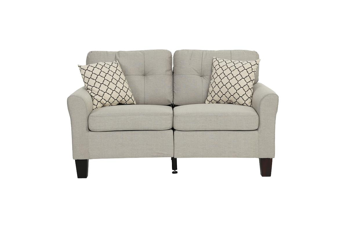 Light grey tufted loveseat with decorative pillows  characters