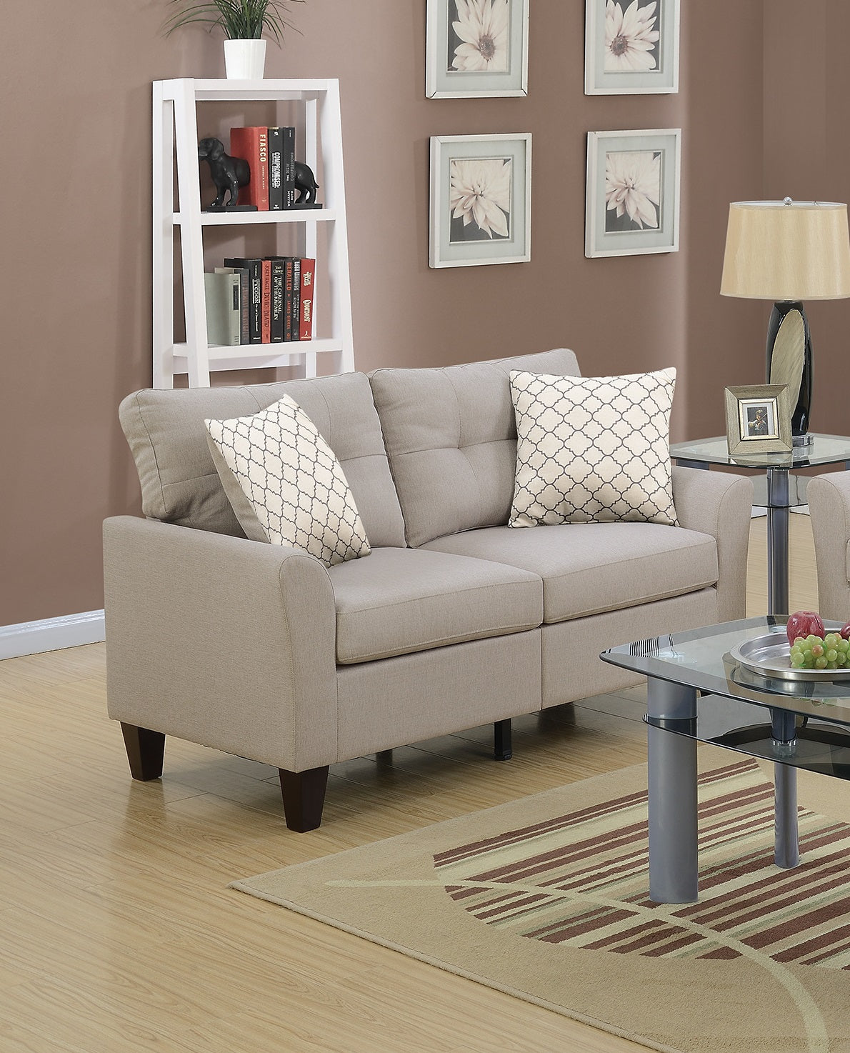 Beige linen loveseat with two decorative patterned throw pillows