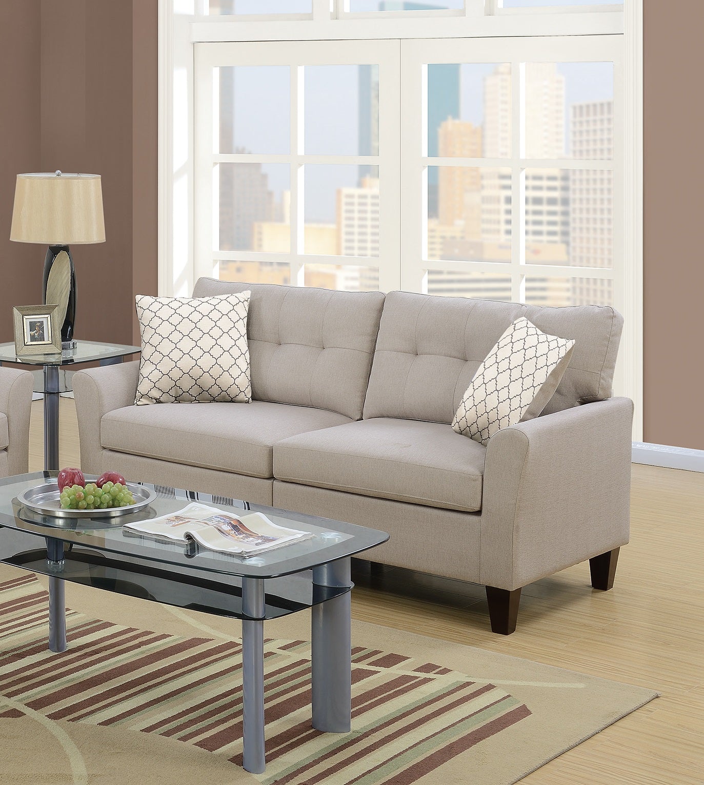 Taupe fabric sofa with tufted back and decorative throw pillows ideal for living rooms