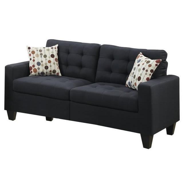 Tufted dark blue fabric sofa with polka dot accent pillows for living room comfort