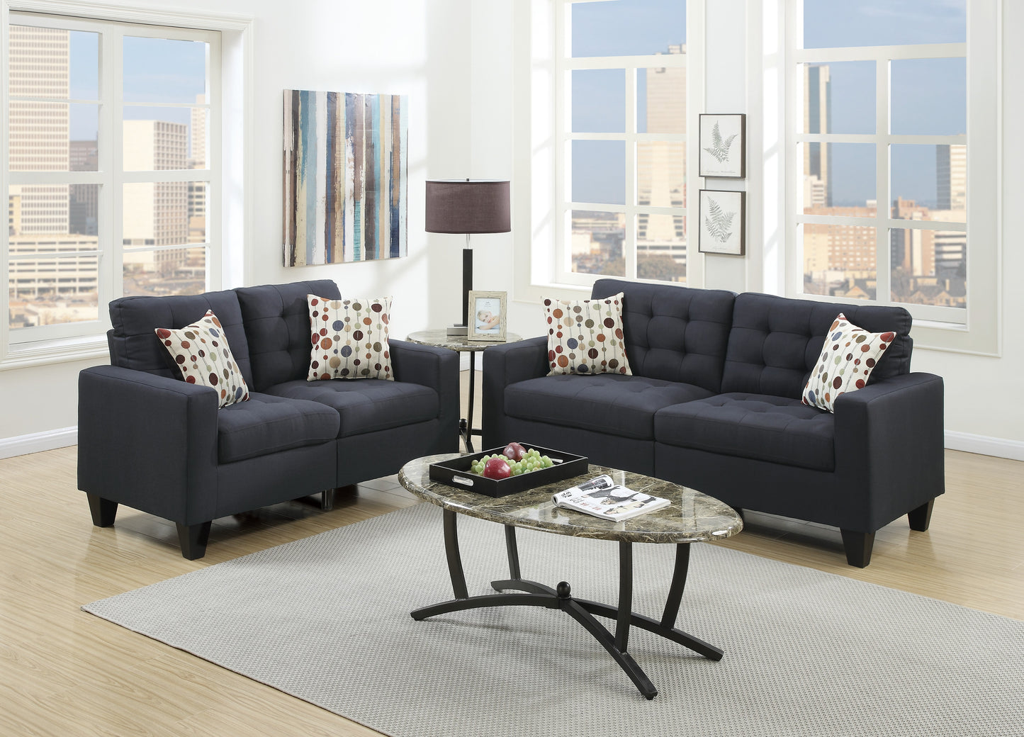 Tufted dark navy fabric sofa with patterned throw pillows for living room comfort