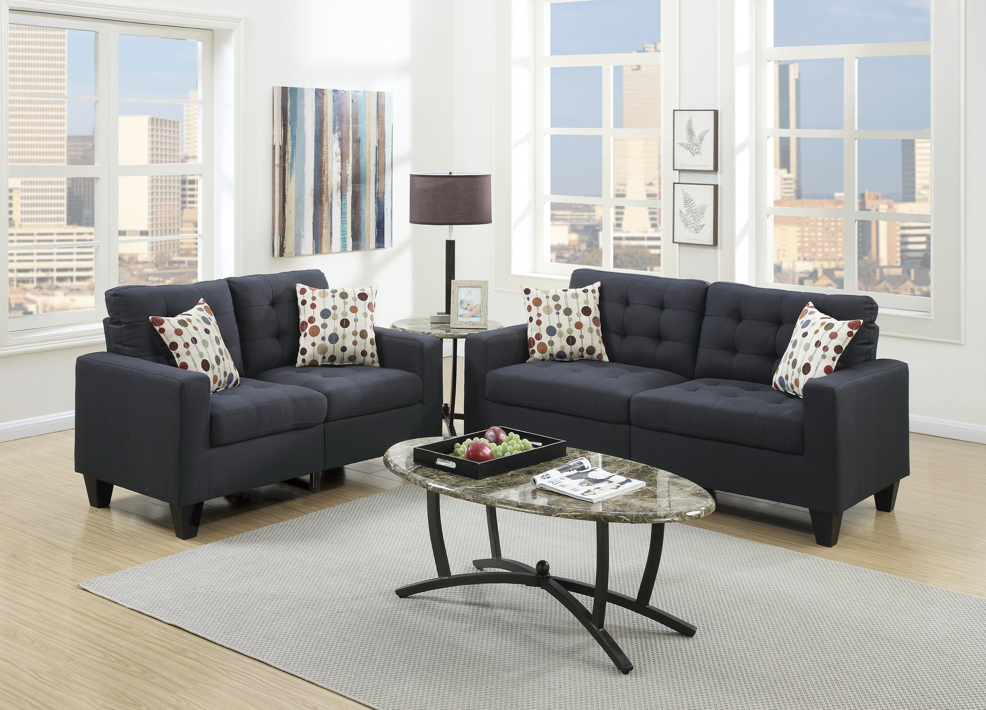 Tufted dark navy fabric sofa with patterned throw pillows for living room comfort