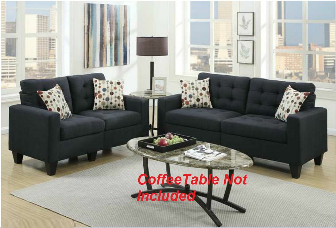 Dark charcoal upholstered loveseat with decorative pillows