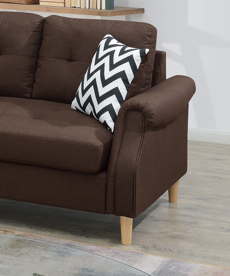 Brown fabric sofa with tufted cushions and a black and white chevron pillow This sofa is perfect for any modern living room