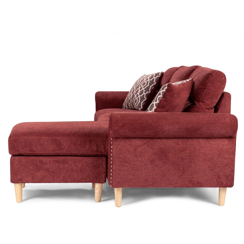 Deep red sectional sofa with chaise lounge and decorative pillows