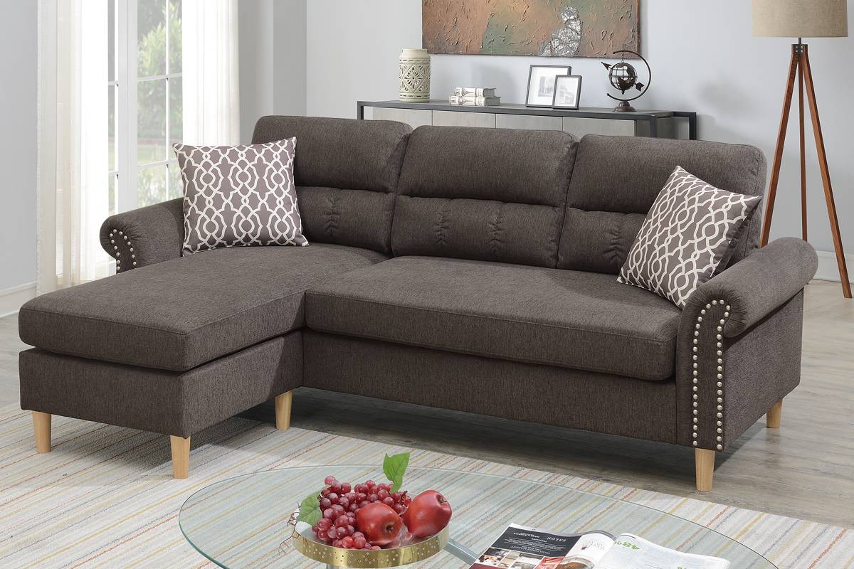 Dark grey fabric sectional sofa with chaise and silver nailhead trim