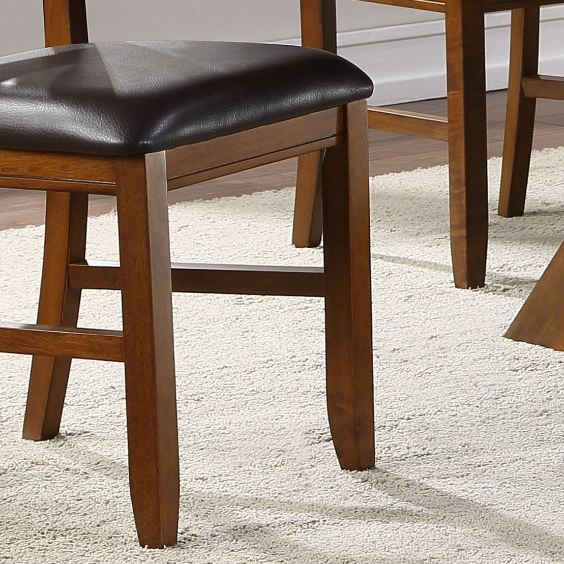 Closeup of a dark brown faux leather padded seat on a wooden counter stool