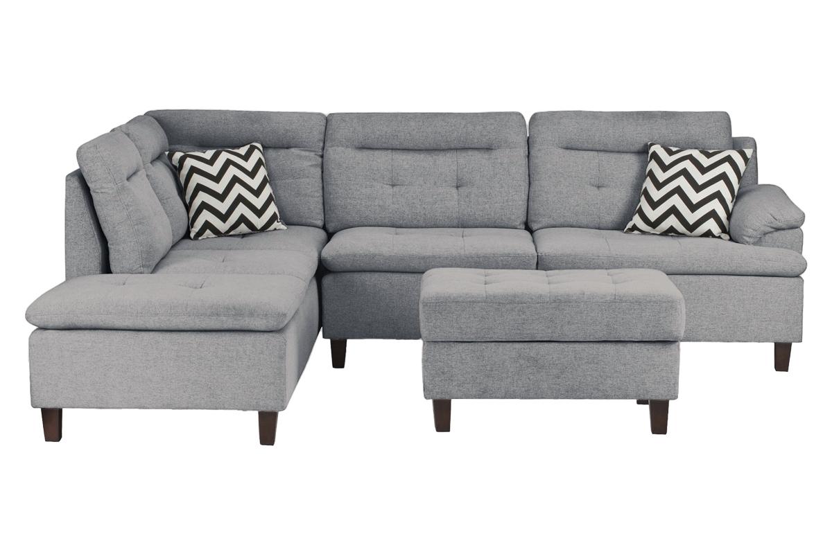 Gray fabric sectional sofa with tufted seats and accent pillows