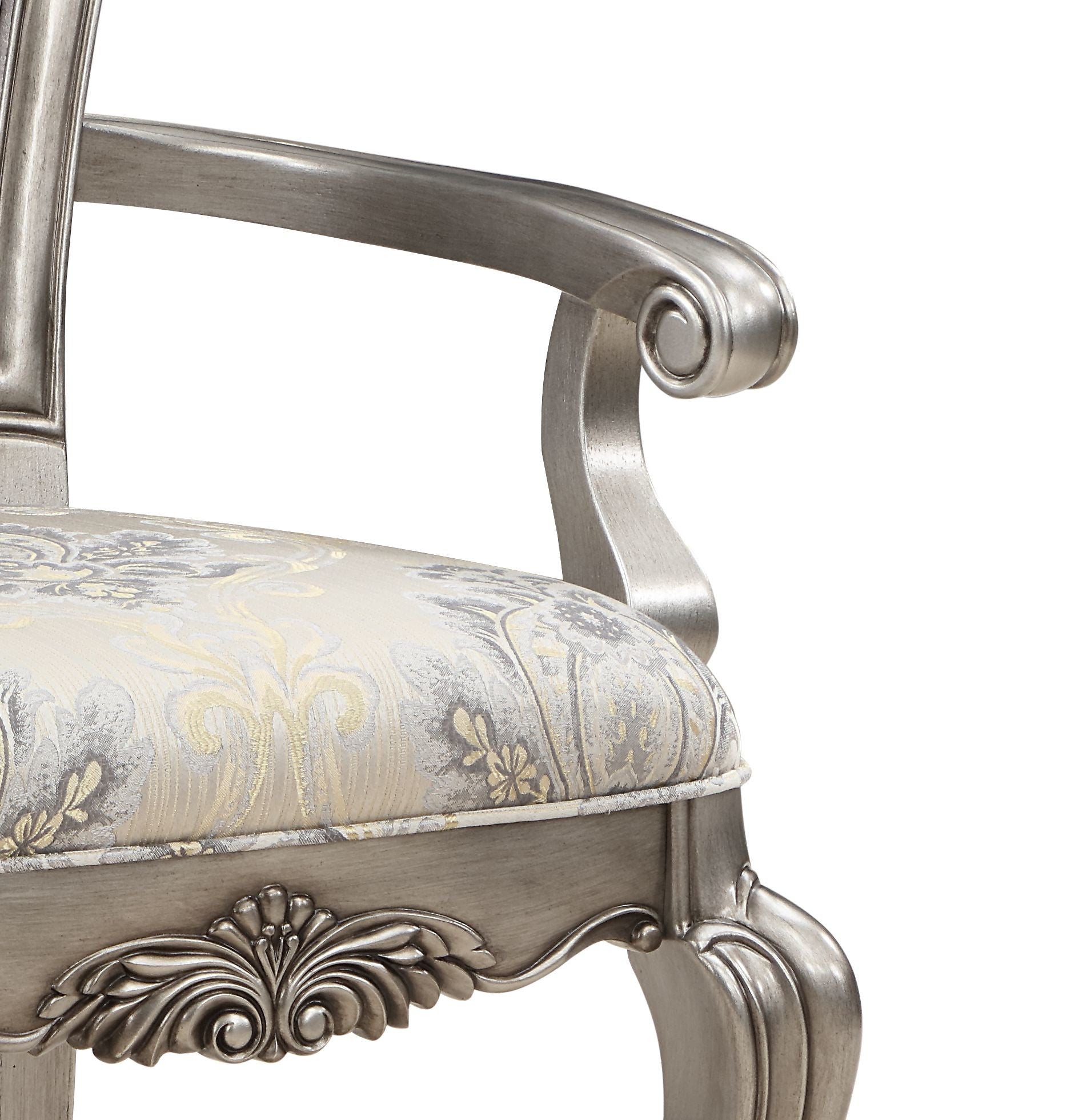 Silver ornate armchair with damask patterned seat and carved wooden legs