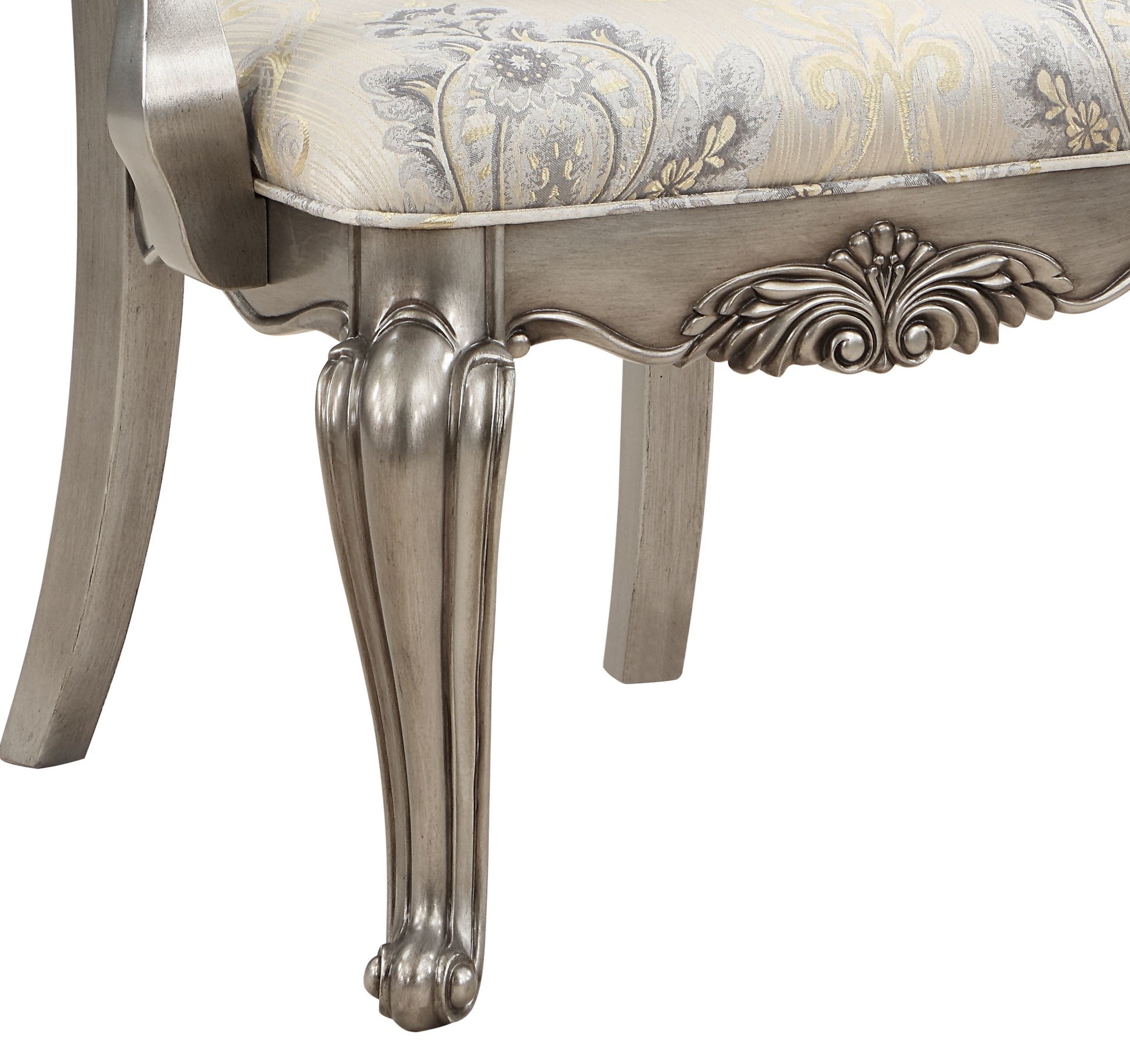 Elegant silverfinished chair leg with intricate carving and ornate scrolled foot perfect for antique furniture