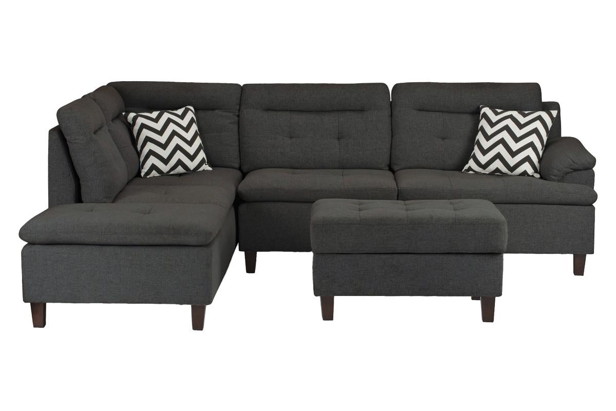 Dark gray fabric sectional sofa with tufted seats and chevron pillows