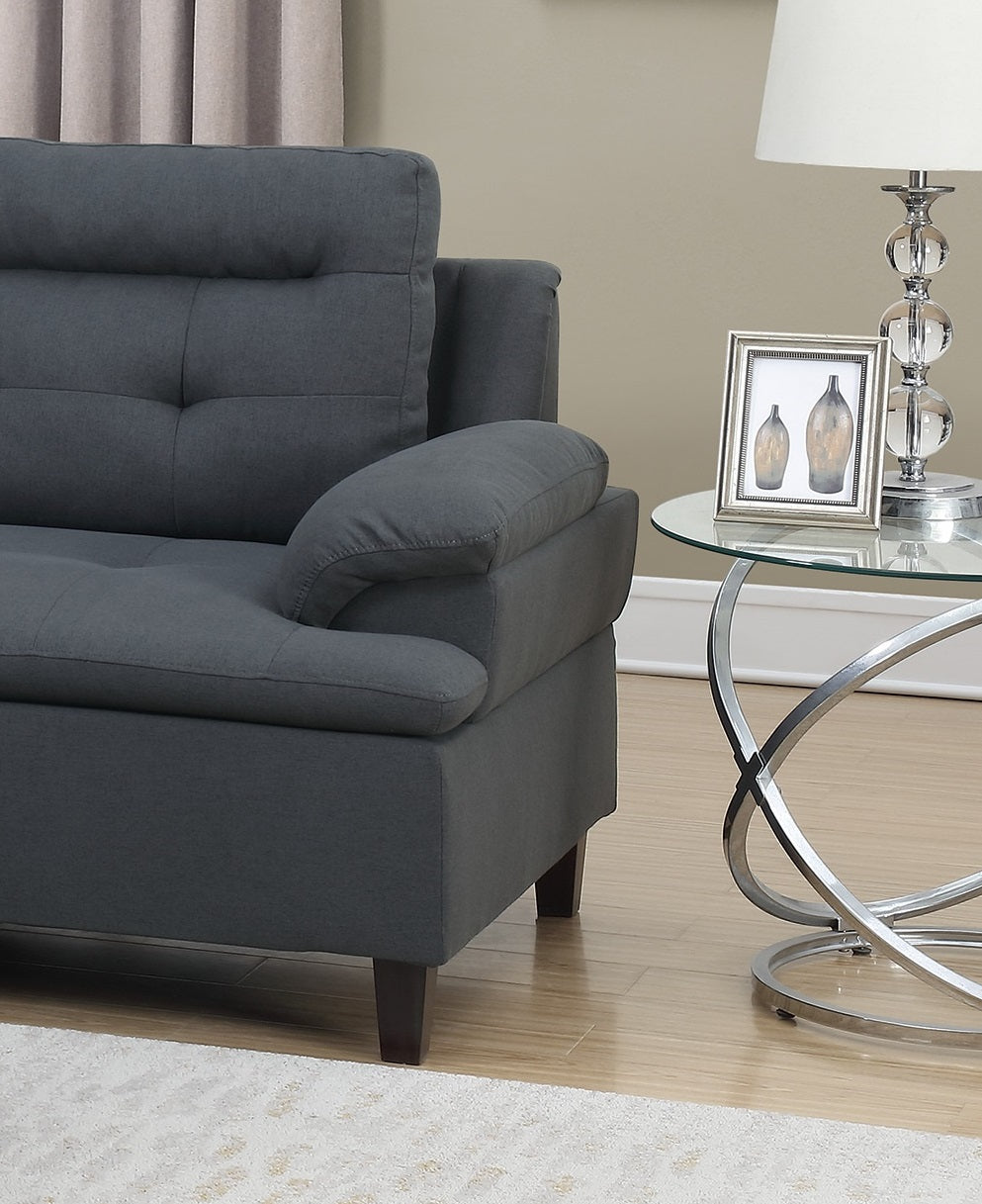 Dark gray fabric sofa with tufted back cushions and wide arms perfect for living room relaxation
