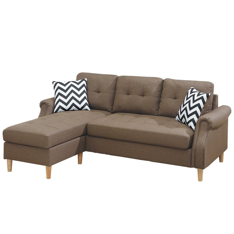 Brown fabric sectional sofa with tufted back cushions and Chevron pillows