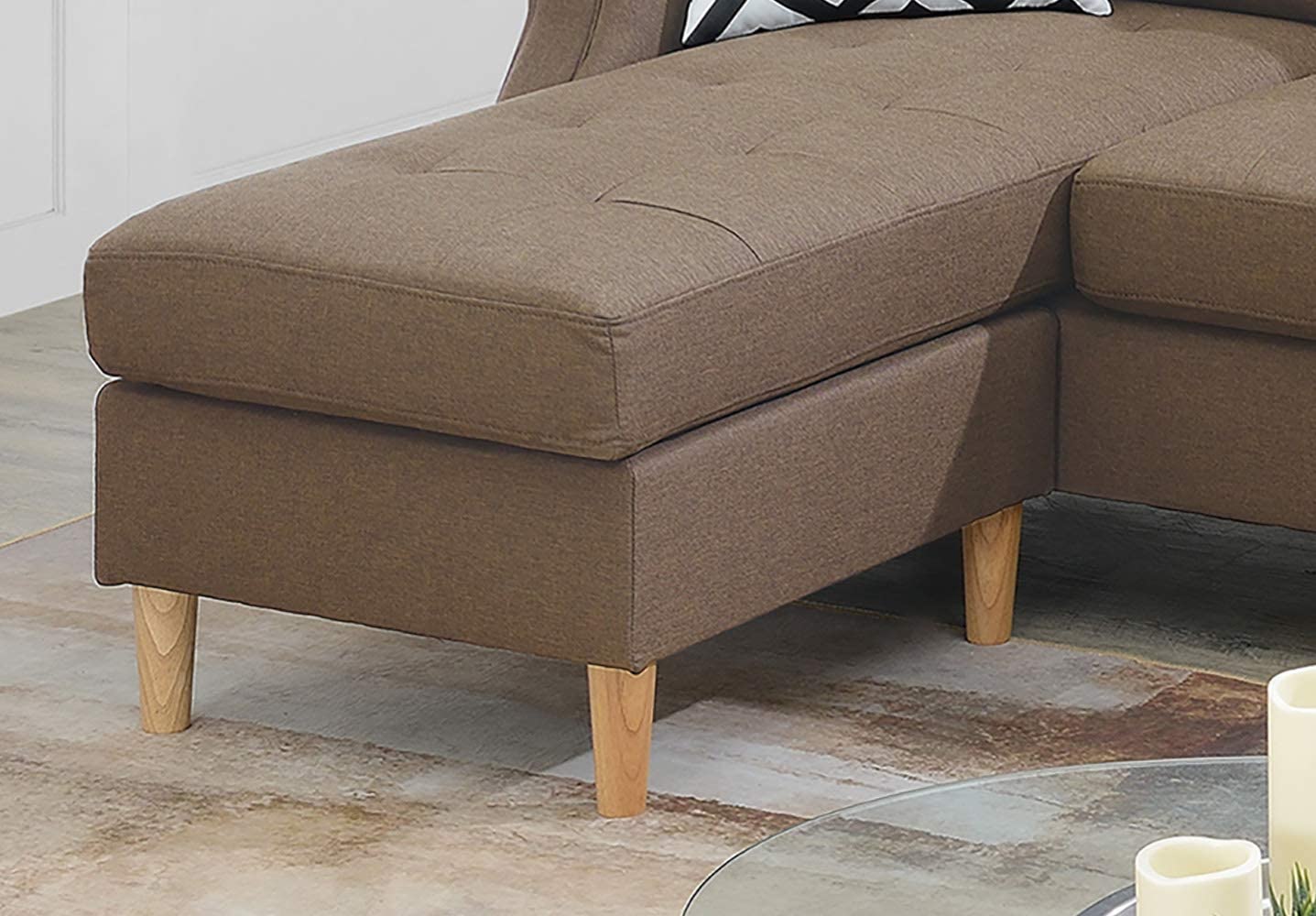Brown fabric sectional sofa chaise with tufted seat and tapered wooden legs
