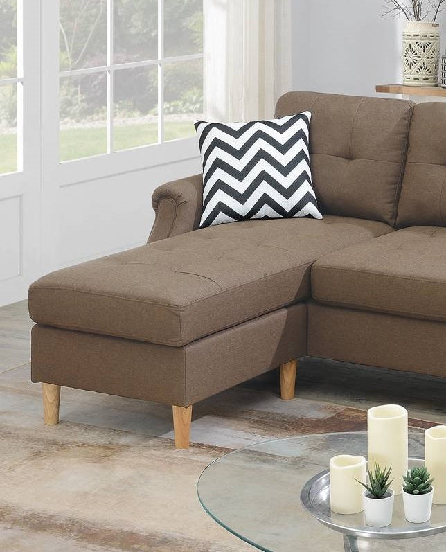 Brown fabric sectional sofa with chaise and chevron throw pillow