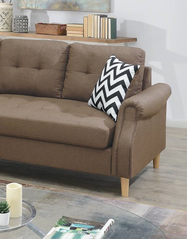 Brown tufted fabric sofa with a black and white chevron pillow modern design