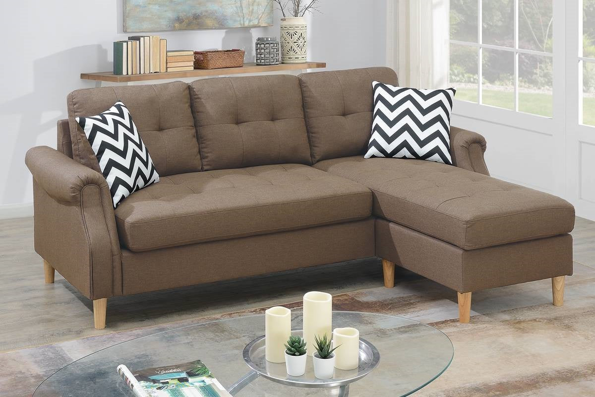 Tufted brown fabric sectional sofa with chaise and black and white chevron pillows