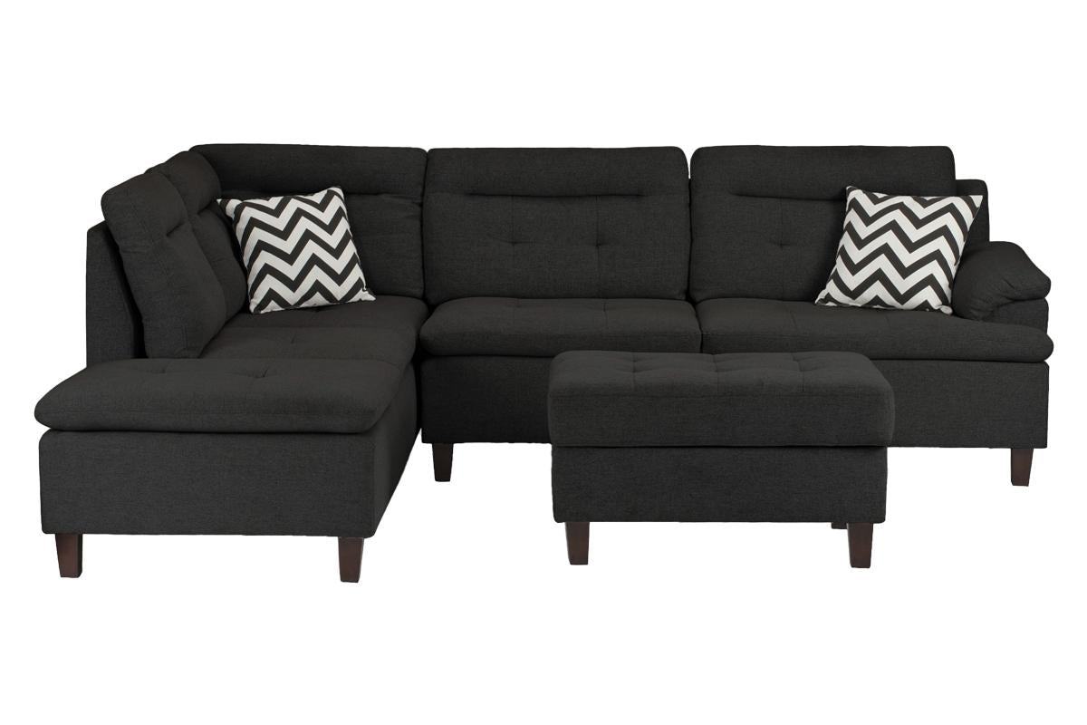 Dark charcoal fabric sectional sofa with chevron throw pillows and matching ottoman