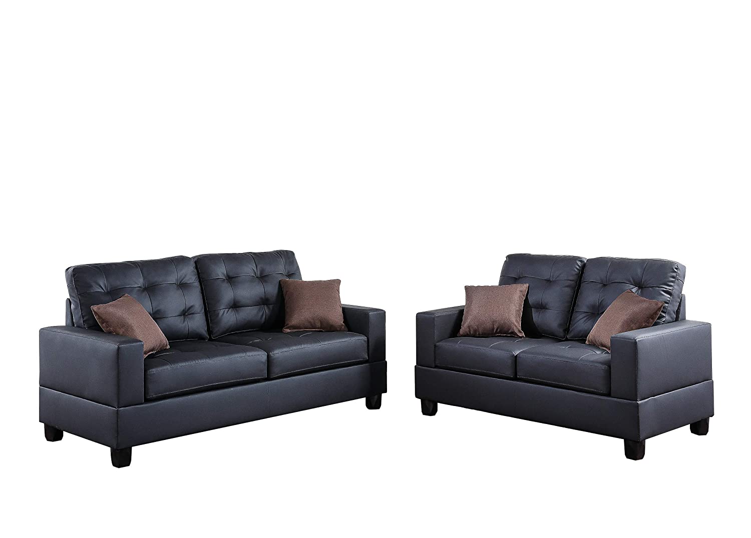 Two dark gray tufted faux leather sofas with brown throw pillows perfect for modern living rooms