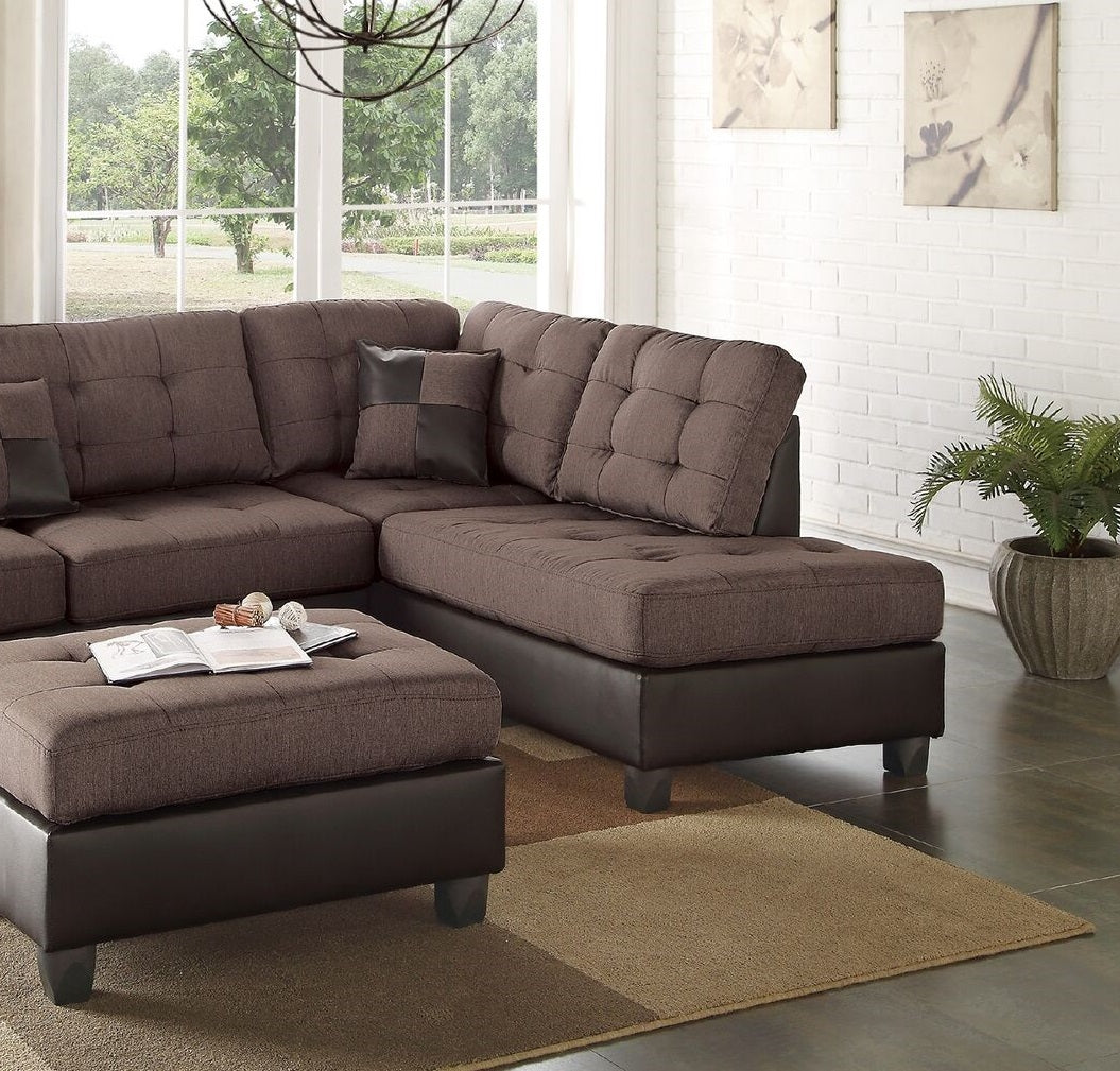 Tufted brown fabric sectional sofa with a dark brown leather base and matching ottoman