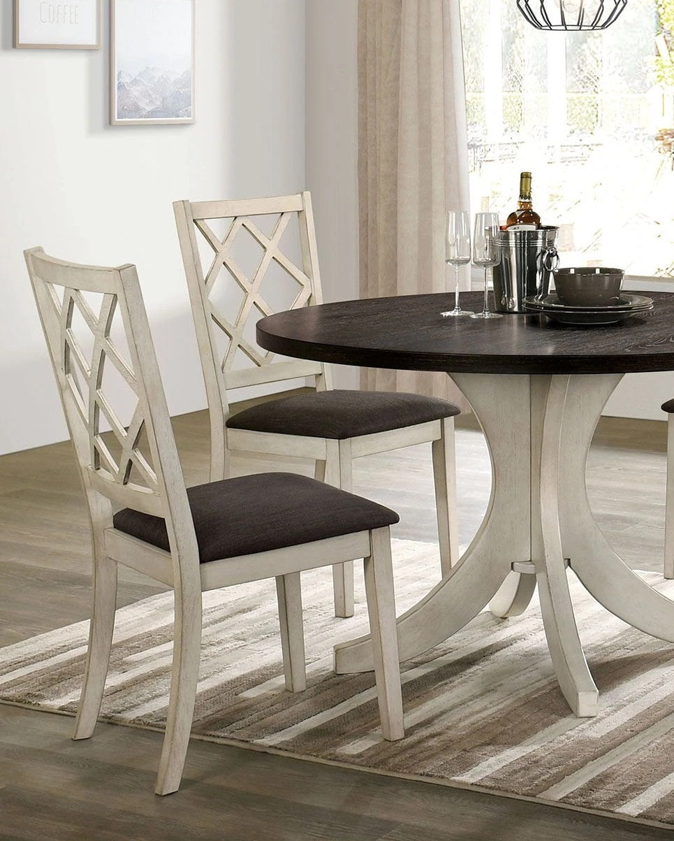 White wood dining chairs with diamond back design and upholstered seats perfect for a farmhouse kitchen