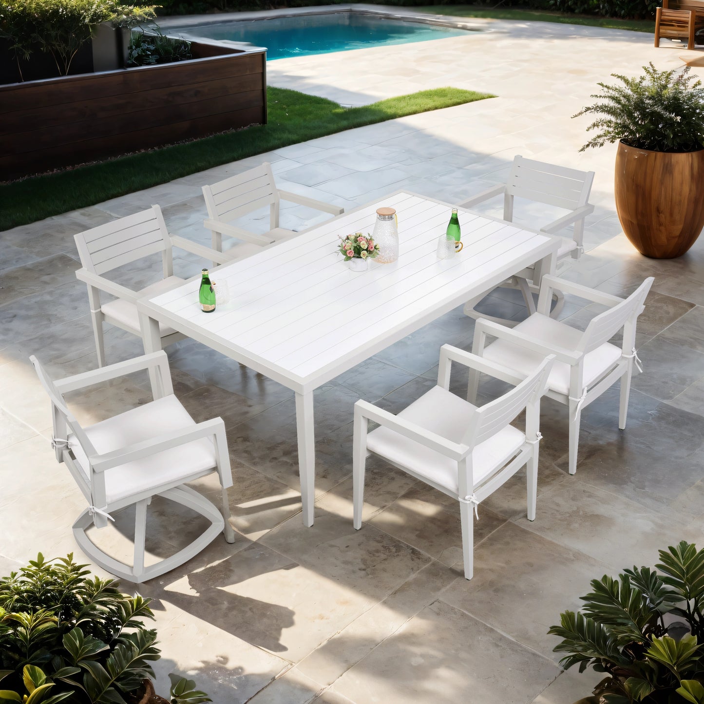 White aluminum patio dining set with rectangular table and cushioned chairs perfect for outdoor entertaining