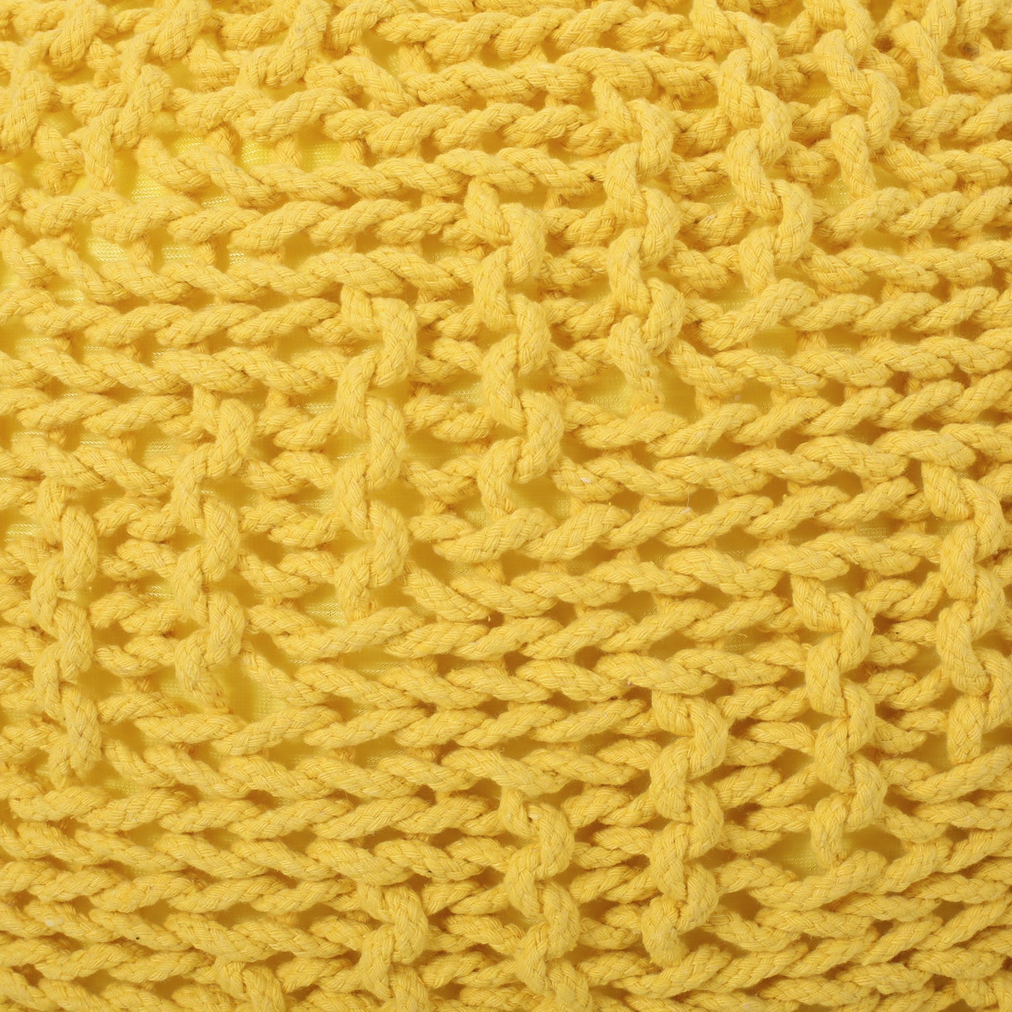Closeup of textured yellow knit fabric with thick braided yarn details