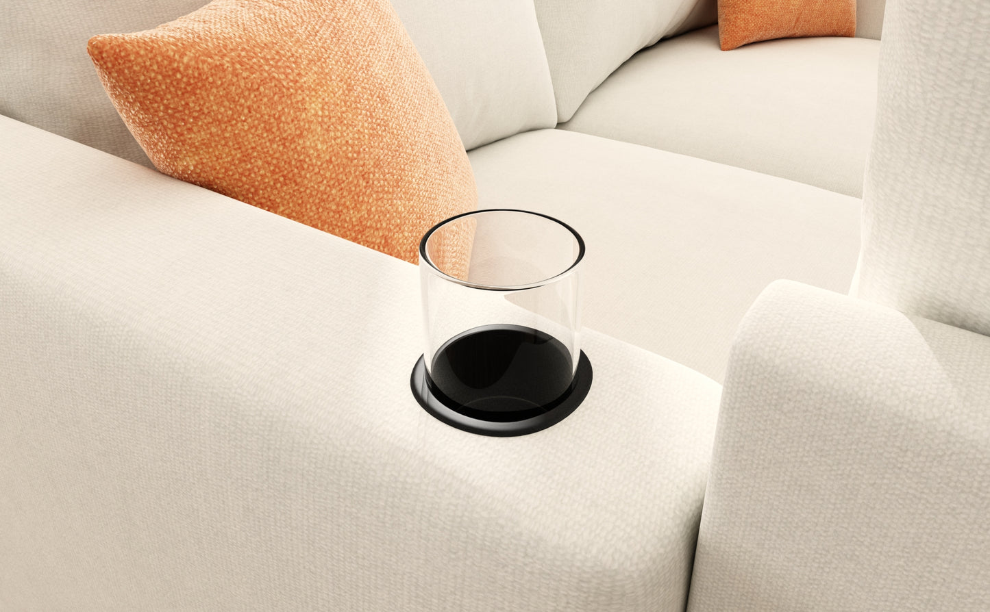 Cream textured sofa with integrated glass cup holder and orange throw pillow