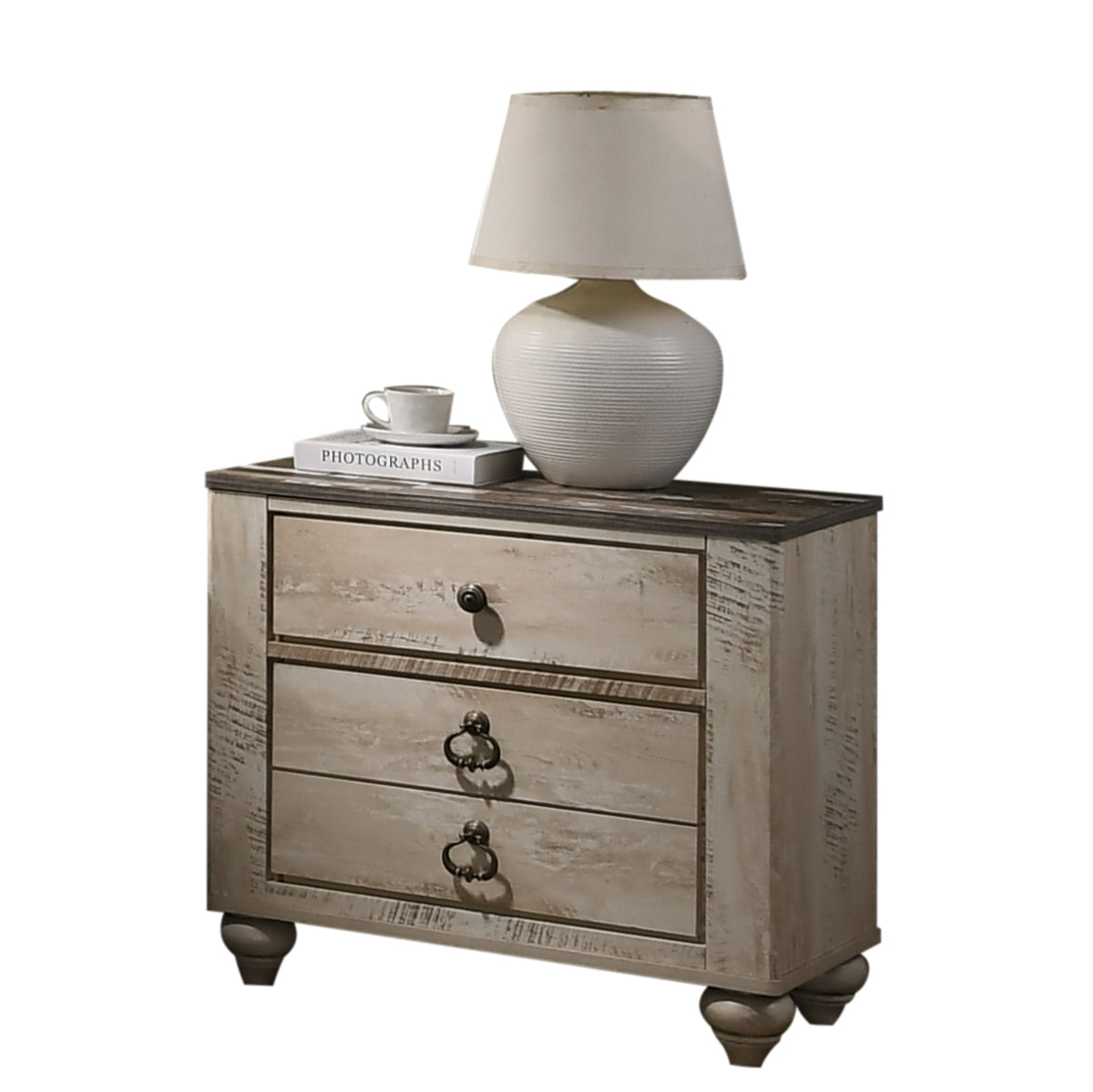 Distressed white bedside table with three drawers and antique brass pulls featuring a dark wood top
