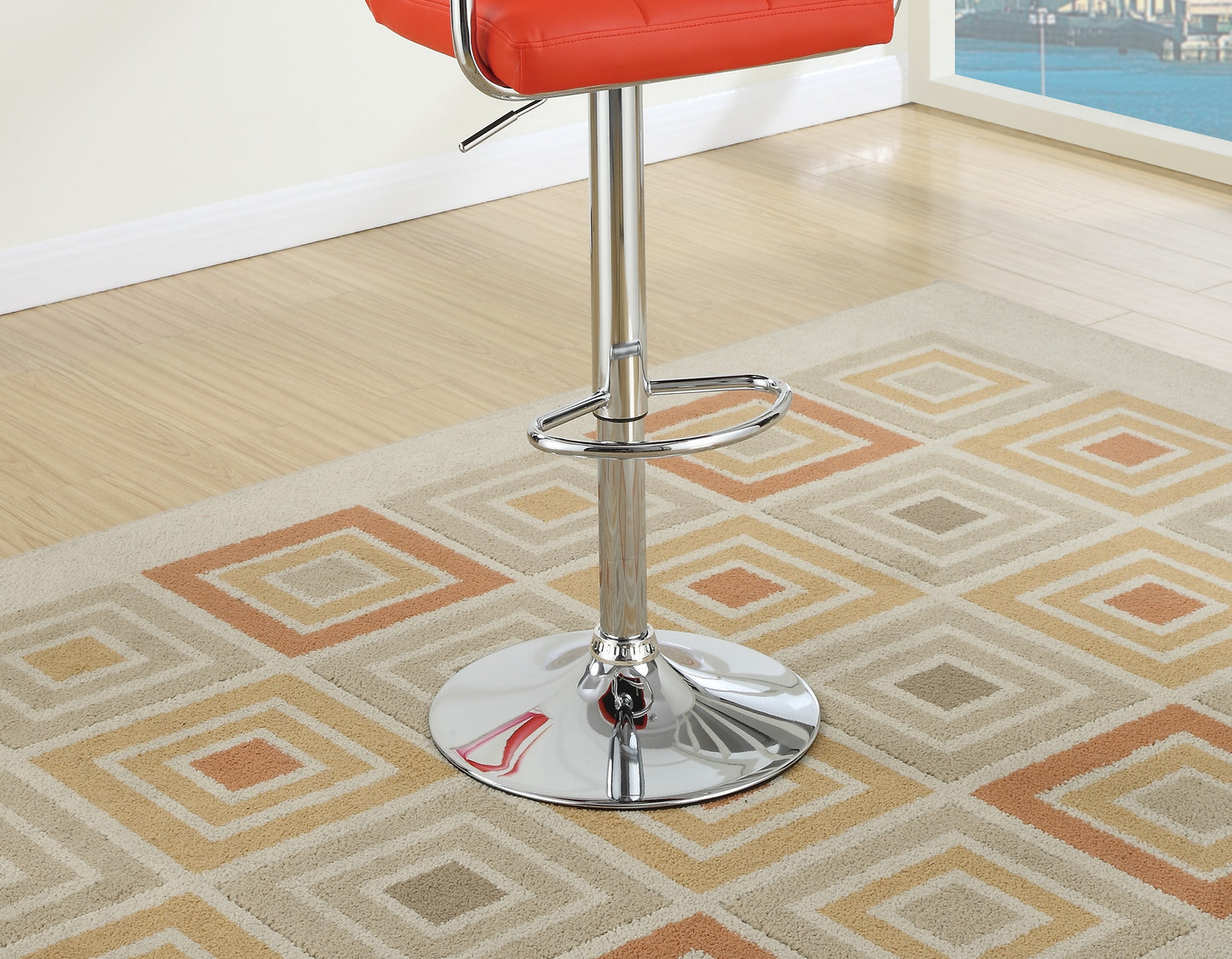 Red leather adjustable bar stool with chrome base on a diamond pattern rug