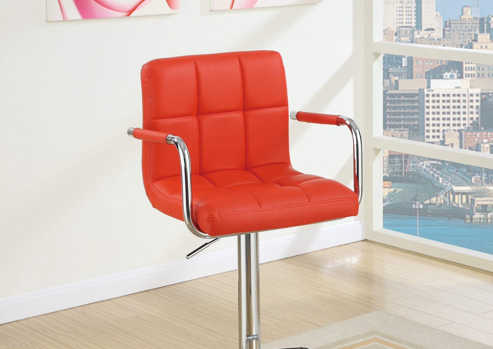 Red faux leather bar stool with chrome accents and adjustable height