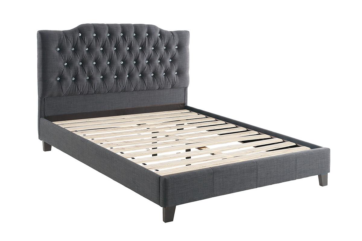 Dark grey fabric upholstered bed frame with diamond tufting and crystal buttons on headboard