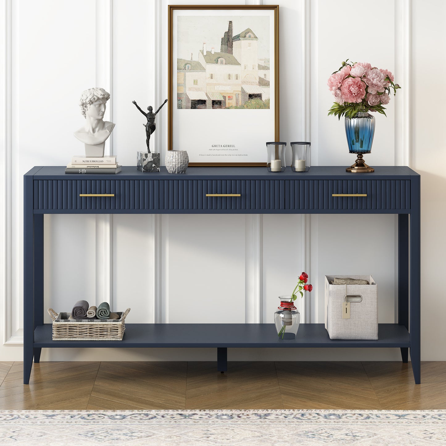 Navy blue console table with fluted drawers and gold hardware
