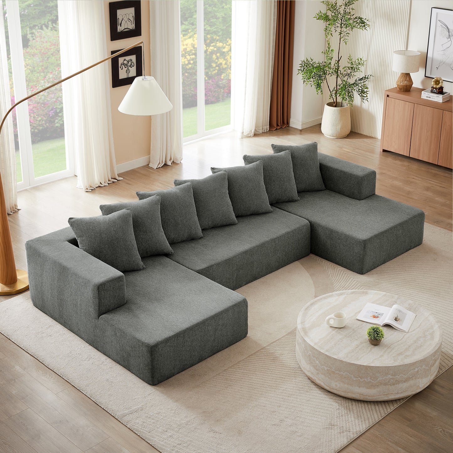 Spacious Ushaped sectional sofa in charcoal grey fabric with plush cushions for modern living rooms