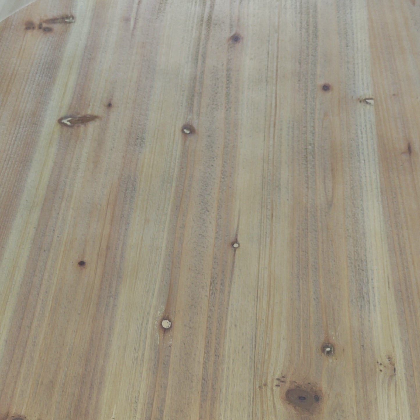 Natural light pine wood planks with visible knots and grain texture