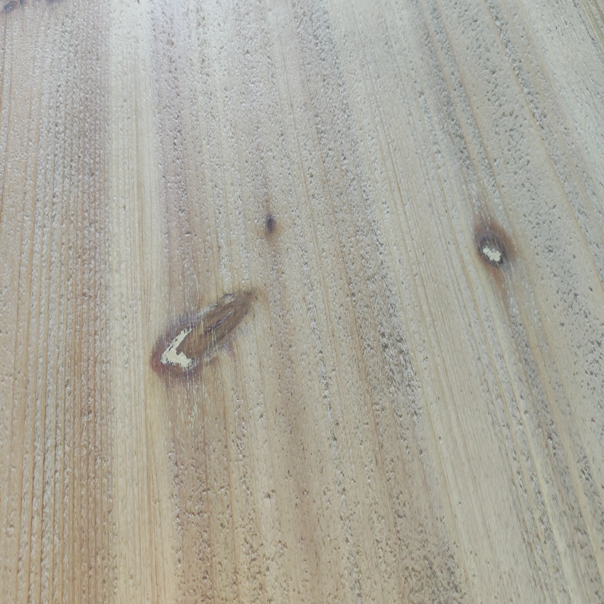 Light brown pine wood texture with knots and visible grain pattern