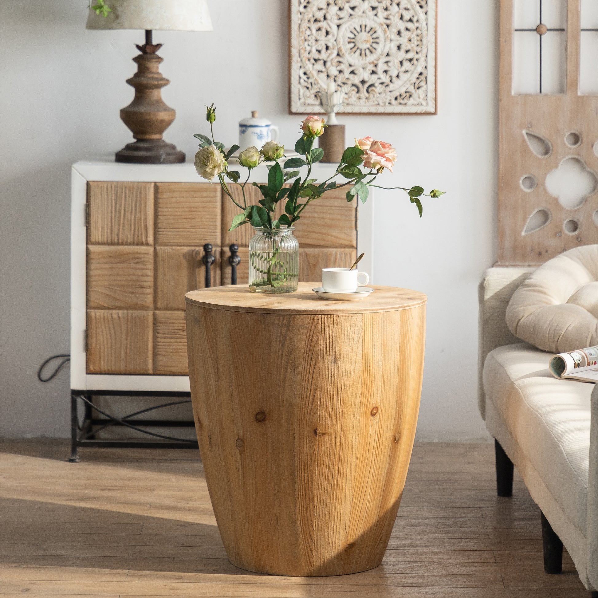 Round natural wood barrel side table with visible grain and knots