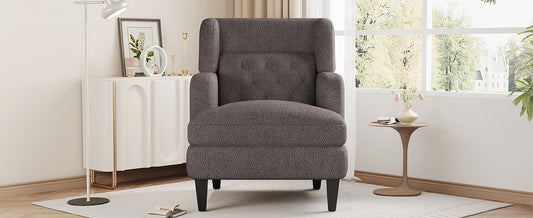 Plush grey armchair with tufted back and padded arms perfect accent chair
