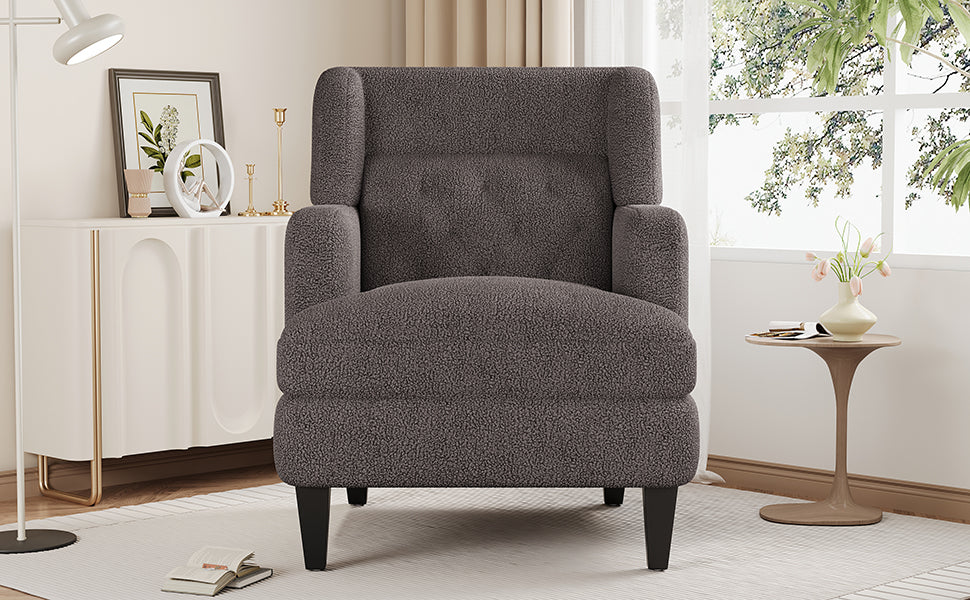 Charcoal grey textured boucle accent chair with button tufting and high back