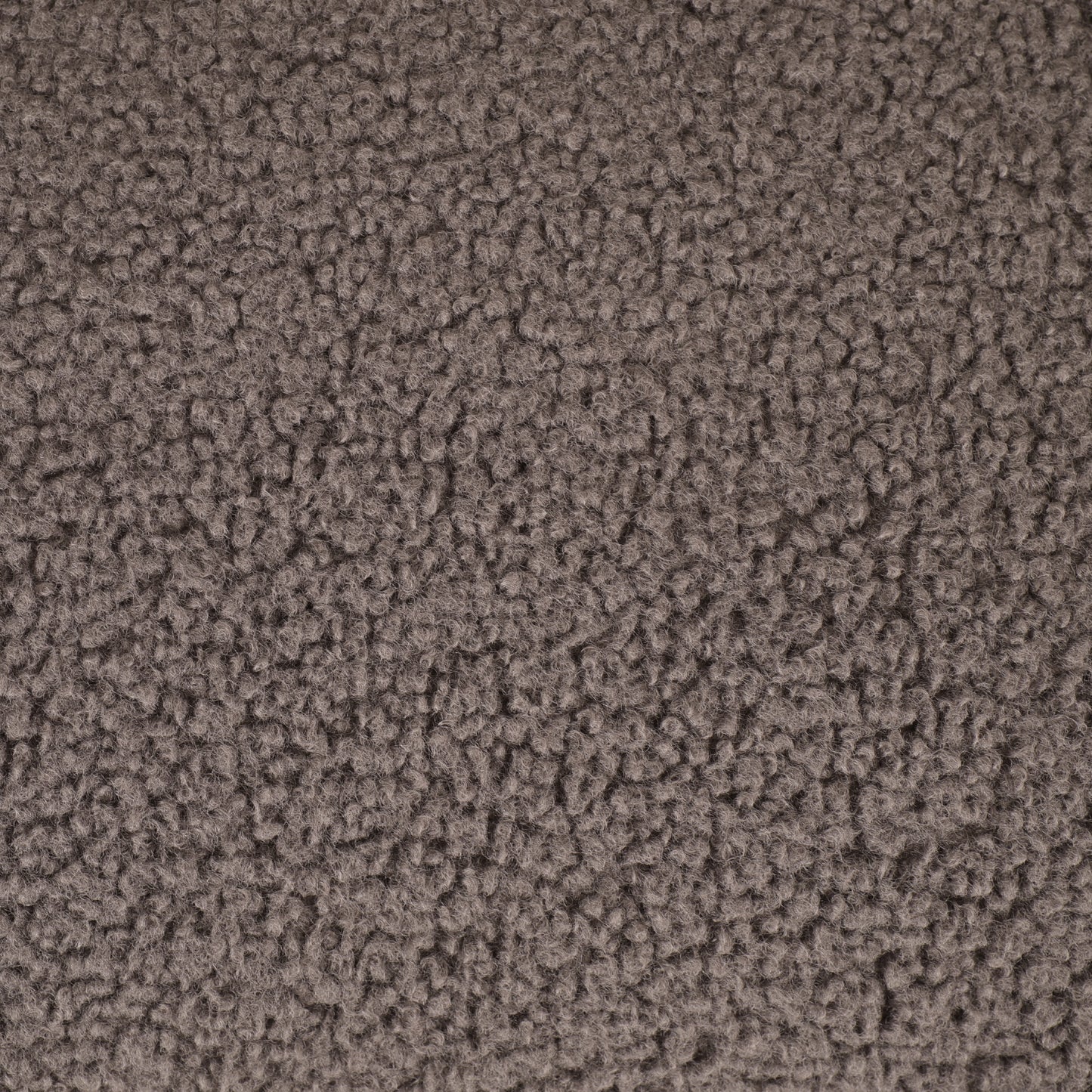 Closeup of textured brown sherpa fabric perfect for cozy blankets and apparel