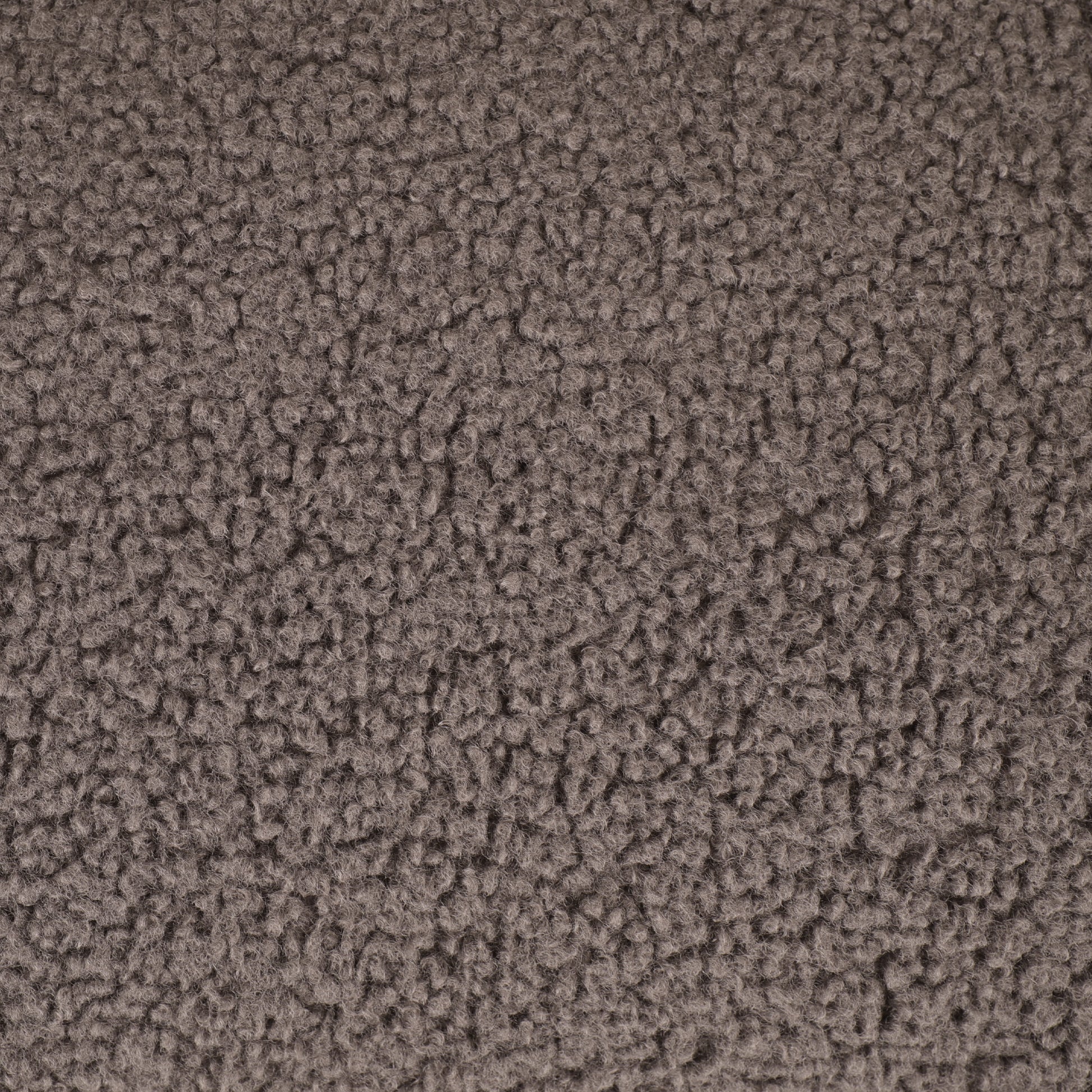 Closeup of textured brown sherpa fabric perfect for cozy blankets and apparel